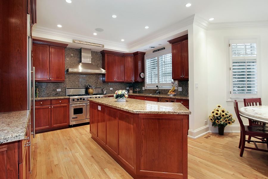 Kitchen with granite used as the backsplash