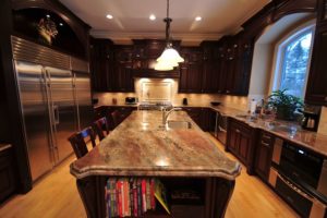 A beautiful granite countertop in a warmly lit kitchen.