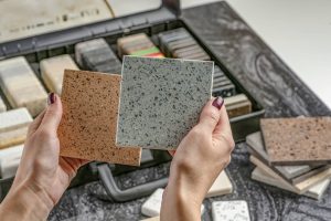 A person looking at granite slabs for their Davie Granite Counters